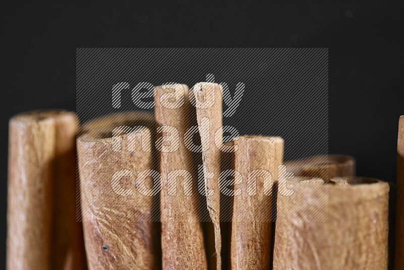 Cinnamon sticks on black background