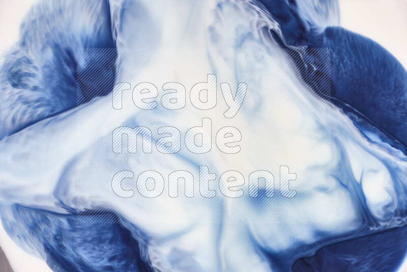 A close-up of abstract swirling patterns in blue and white