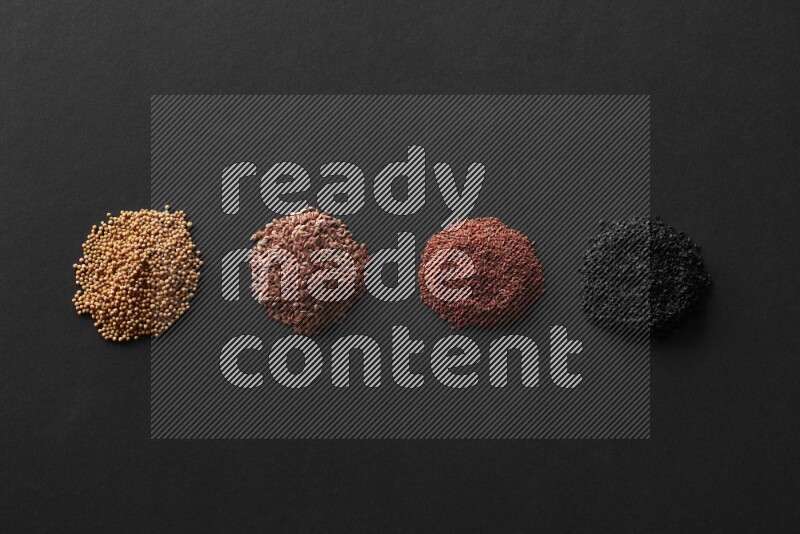 حبة البركة و حبوب الخردل وحبوب الكتان وحب الرشاد علي خلفية سوداء