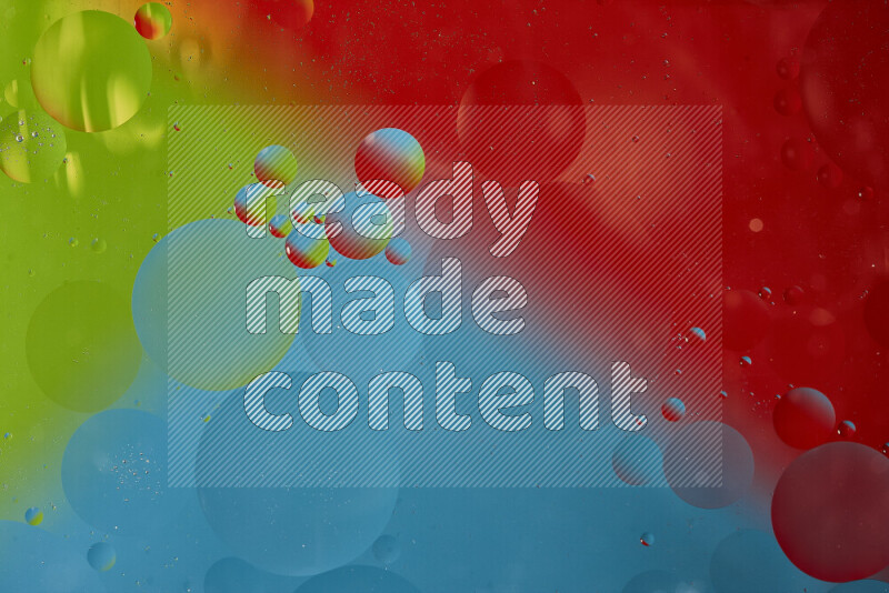 Close-ups of abstract oil bubbles on water surface in shades of blue, red and green