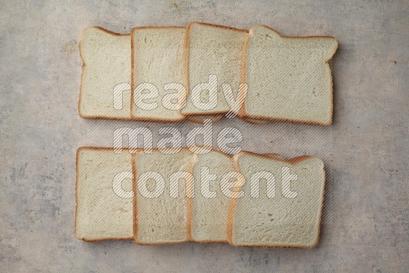 White Toast slices on alight blue textured background