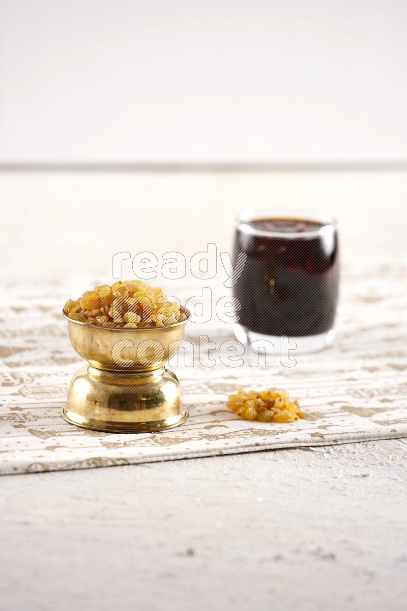Dried fruits in a metal bowl with tamarind in a light setup