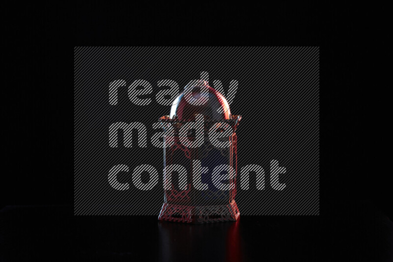 Ramadan lanterns with colored rim light against black background