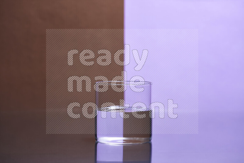 The image features a clear glassware filled with water, set against brown and light purple background