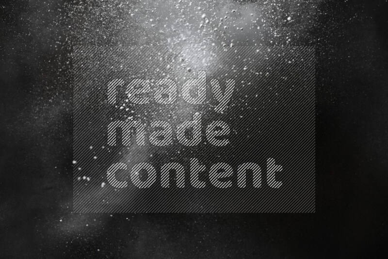 White powder explosion on black background