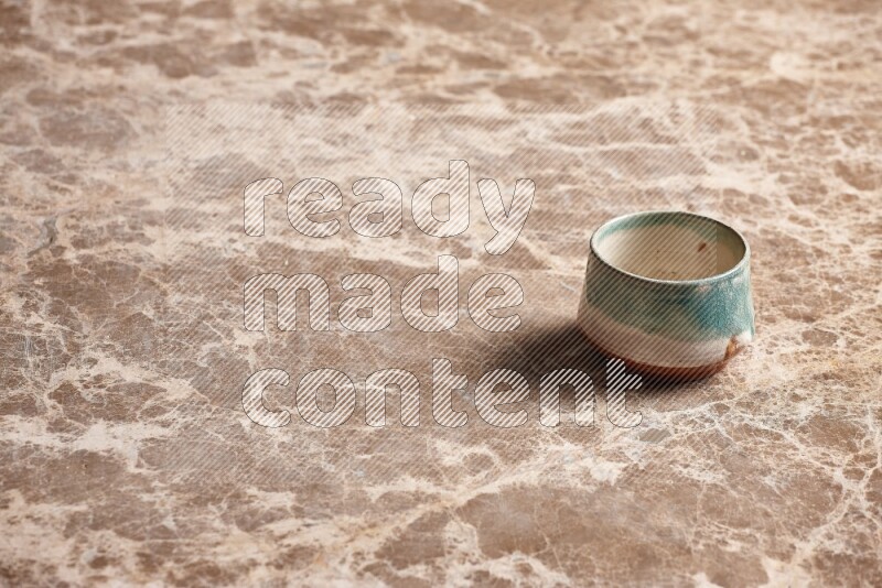 Multicolored Pottery Bowl on Beige Marble Flooring