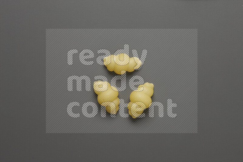 Snails pasta on grey background