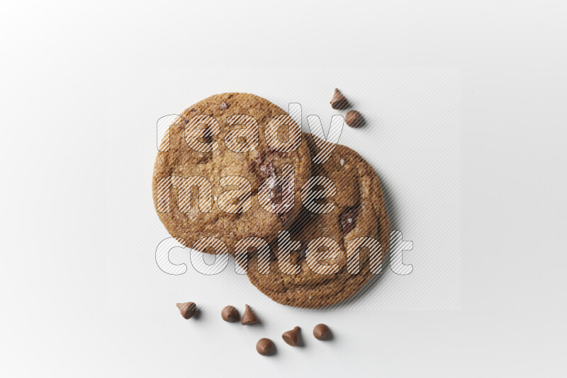 Chocolate chips cookies with chocolate beside it on a white background