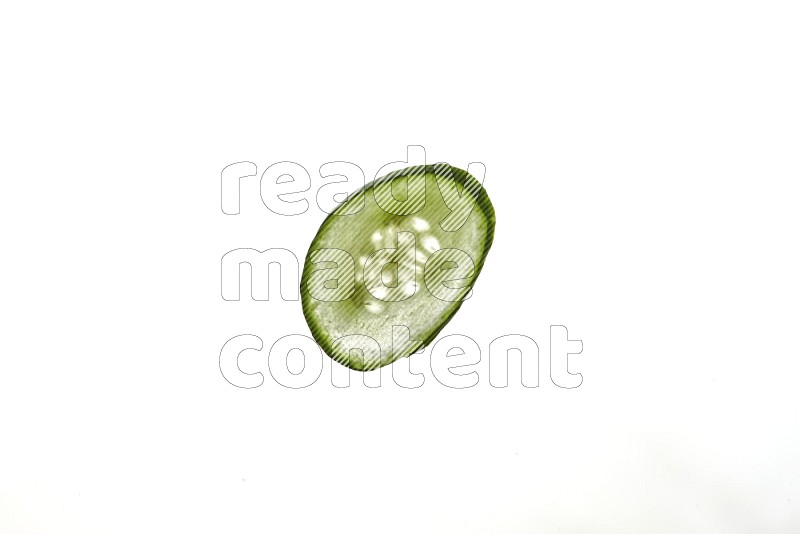 Cucumber slices on illuminated white background