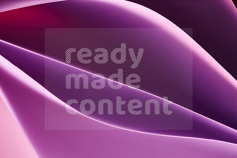 This image showcases an abstract paper art composition with paper curves in purple and pink gradients created by colored light