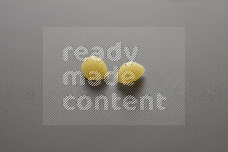 Shells pasta on grey background