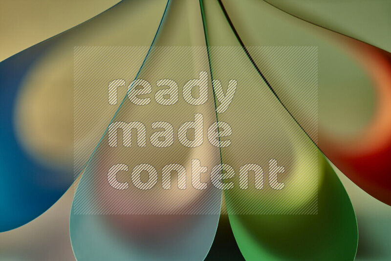 An abstract art piece displaying smooth curves in colorful gradients created by colored light