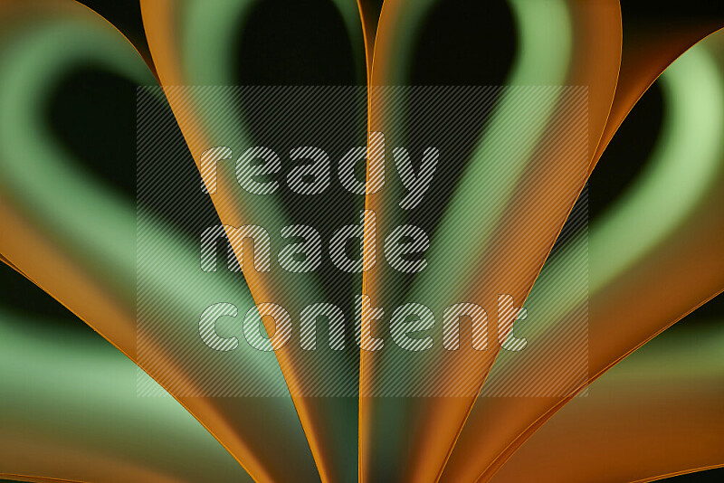 An abstract art piece displaying smooth curves in green and orange gradients created by colored light