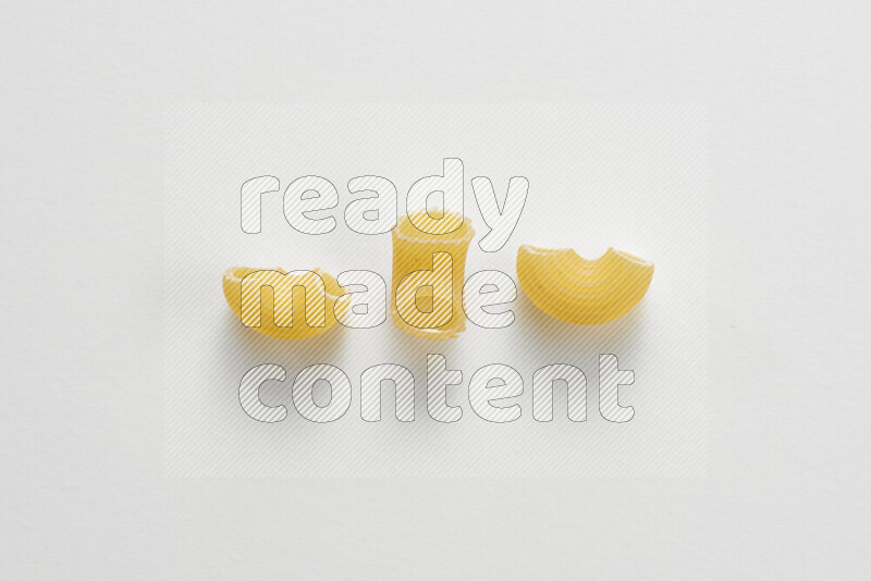 Elbow pasta on white background