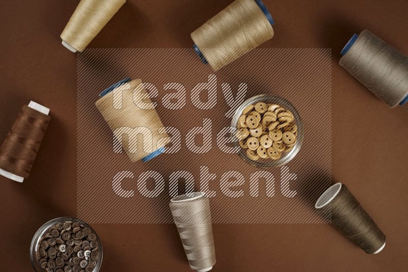 Brown sewing supplies on brown background