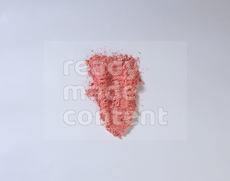Red powder strokes on white background