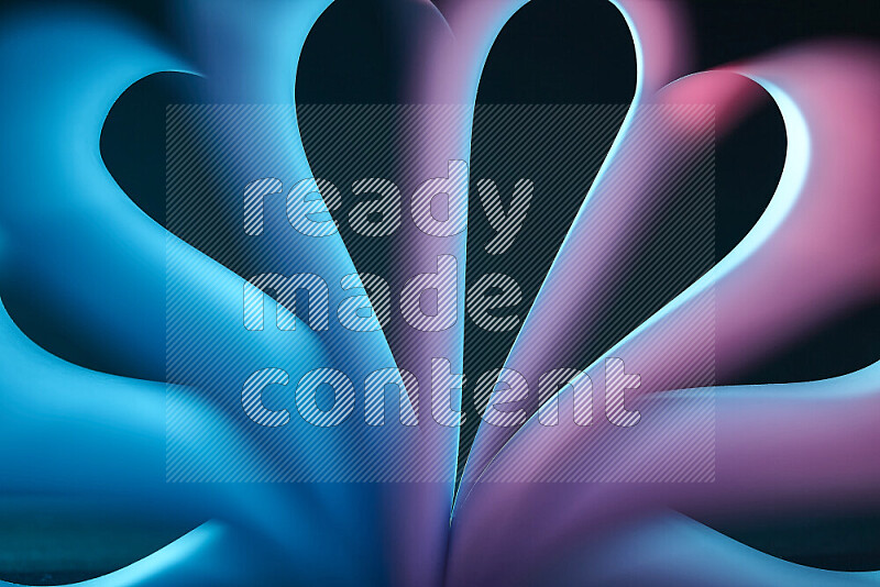 An abstract art piece displaying smooth curves in blue and pink gradients created by colored light