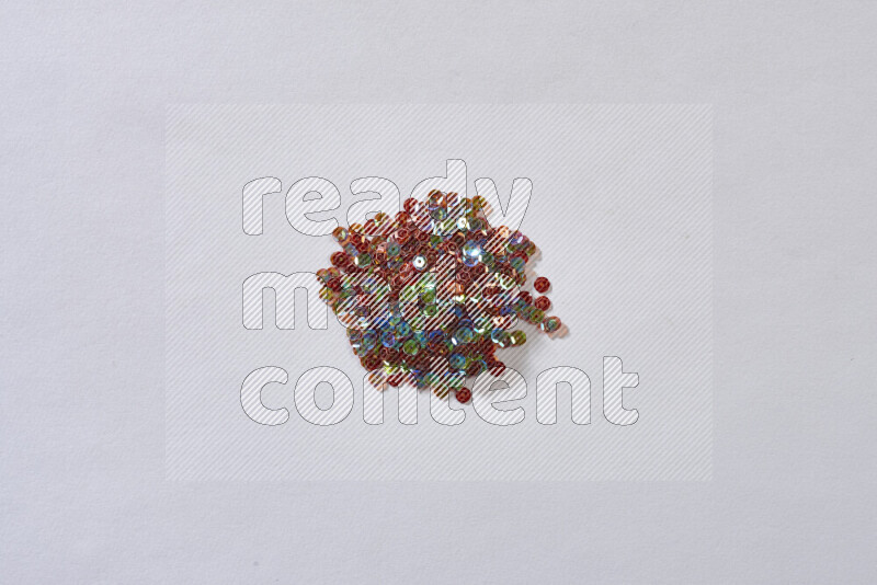 Multicolored flat sequins on grey background