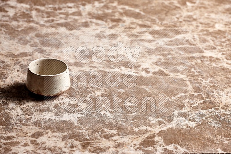 Beige Pottery Bowl on Beige Marble Flooring, 45 degrees