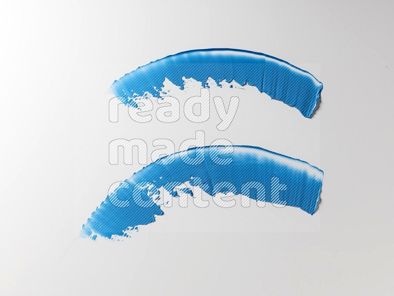 Blue curved painting knife strokes on white background