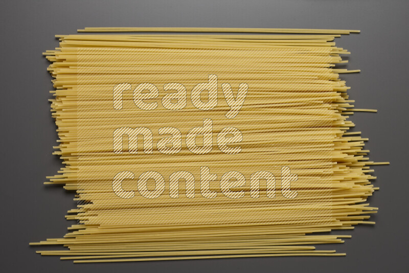 Spaghetti pasta on grey background