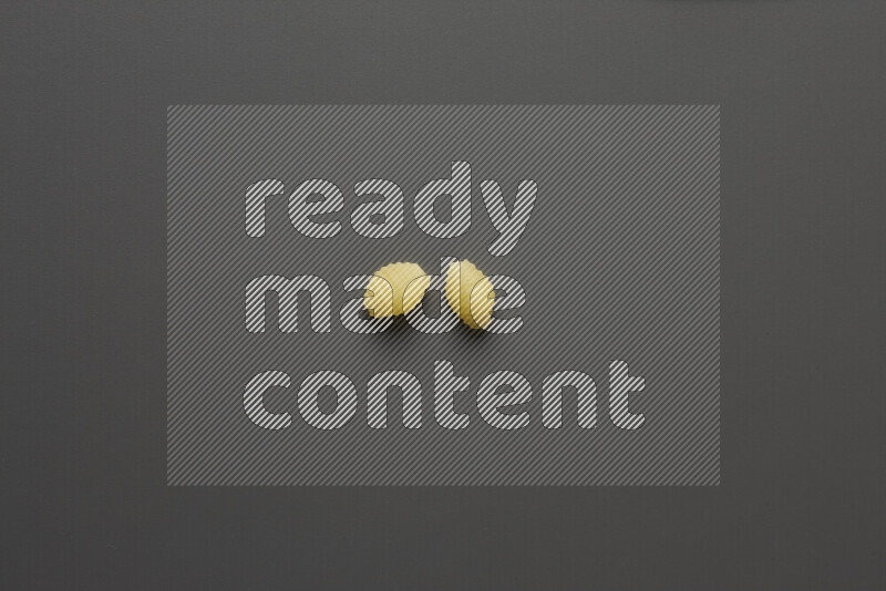 Shells pasta on grey background