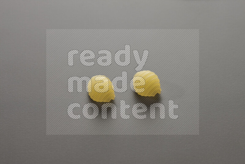 Shells pasta on grey background