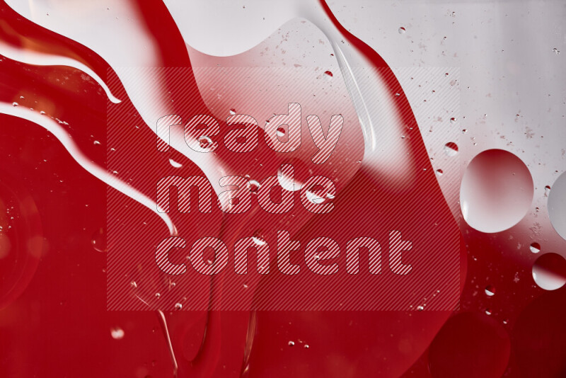 Close-ups of abstract oil bubbles on water surface in shades of white and red
