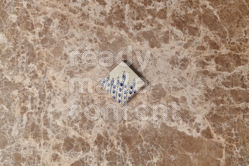 A decorative coaster on beige marble background