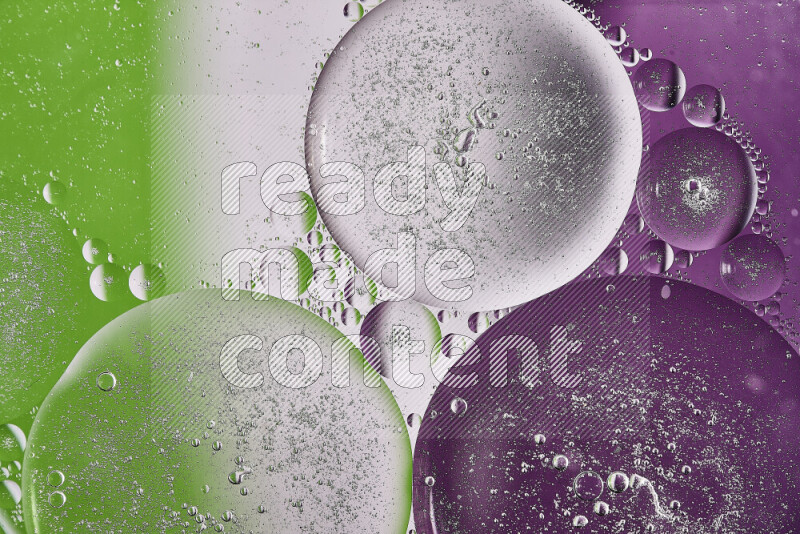 Close-ups of abstract oil bubbles on water surface in shades of purple, green and white