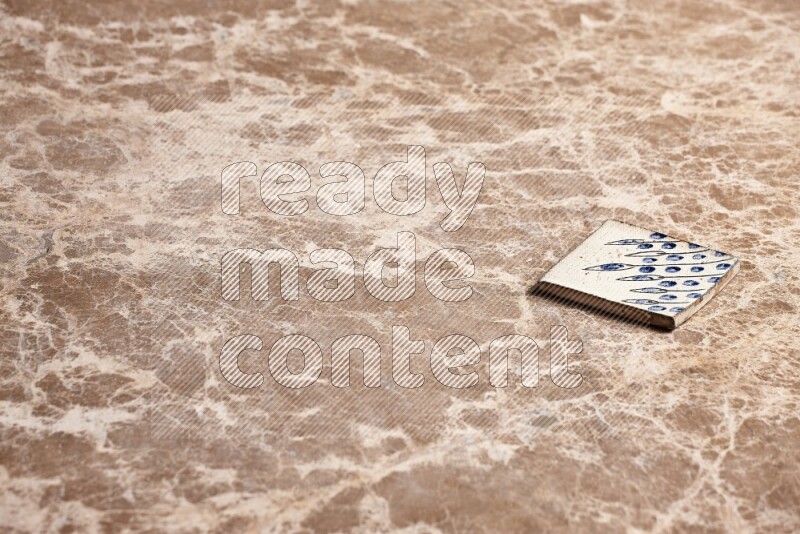 A decorative coaster on beige marble background