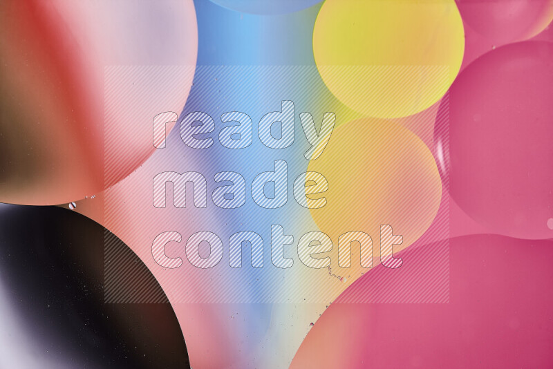 Close-ups of abstract oil bubbles on water surface in multicolors