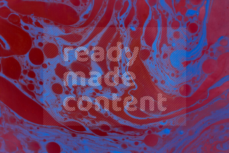 The image depicts a marbling effect with swirling patterns of red and blue