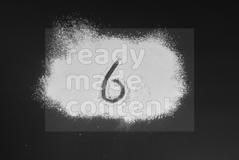 Numbers written with powder on black background