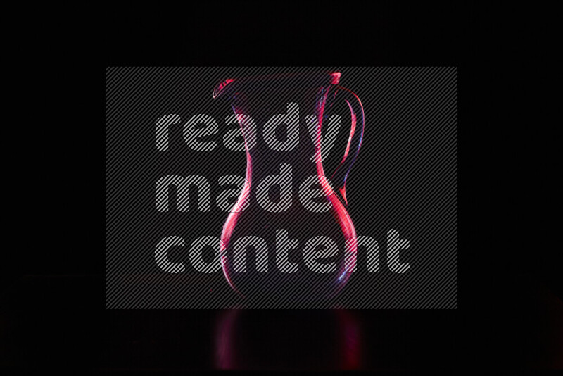 Glassware with rim light in red against black background