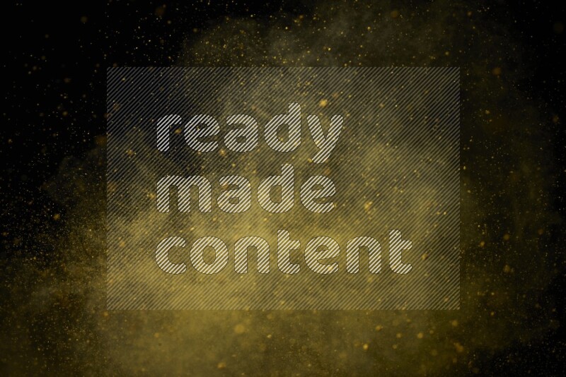 Yellow powder explosion on black background