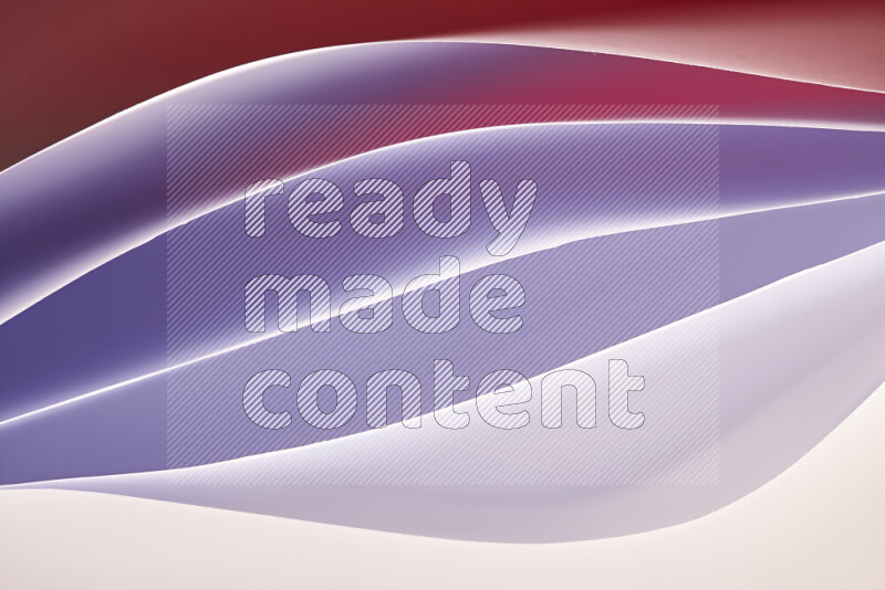 هذه الصورة تعرض تكوين فن الورق التجريدي مع منحنيات ورقية باللون الأبيض ودرجات دافئة مختلفة المكونه بواسطة الضوء الملون