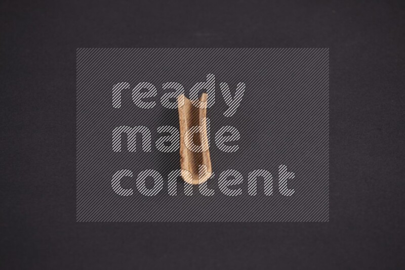 Cinnamon stick on black background