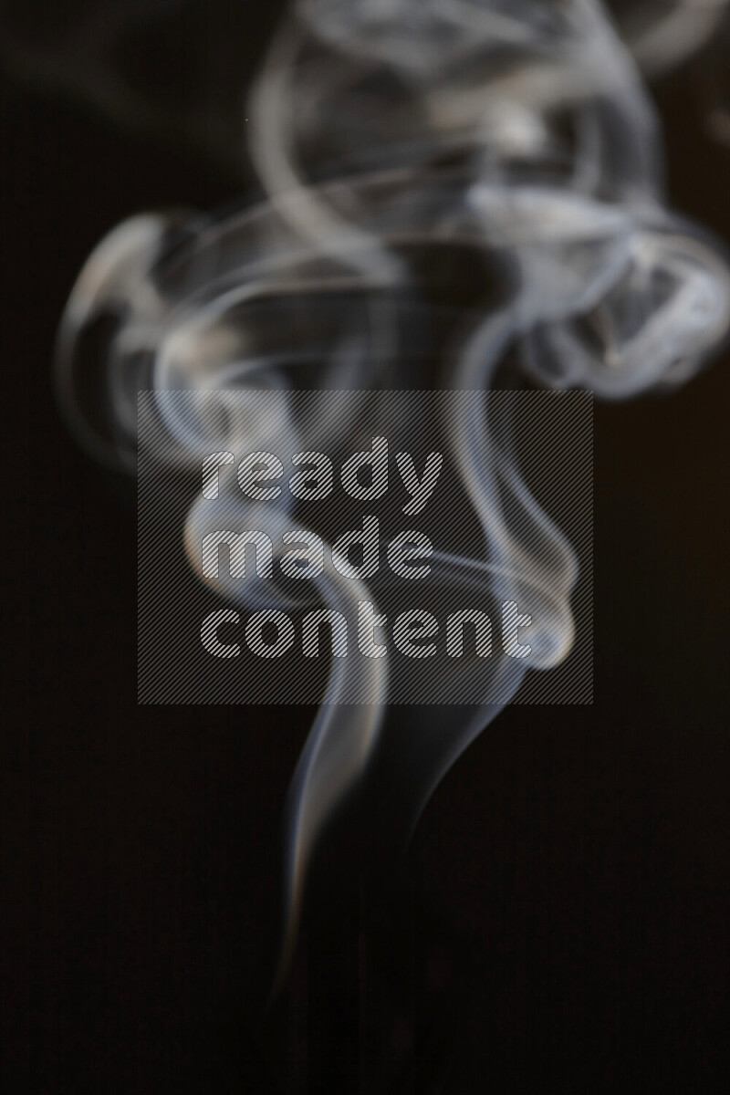 Motion of wavy smoke isolated on dark background