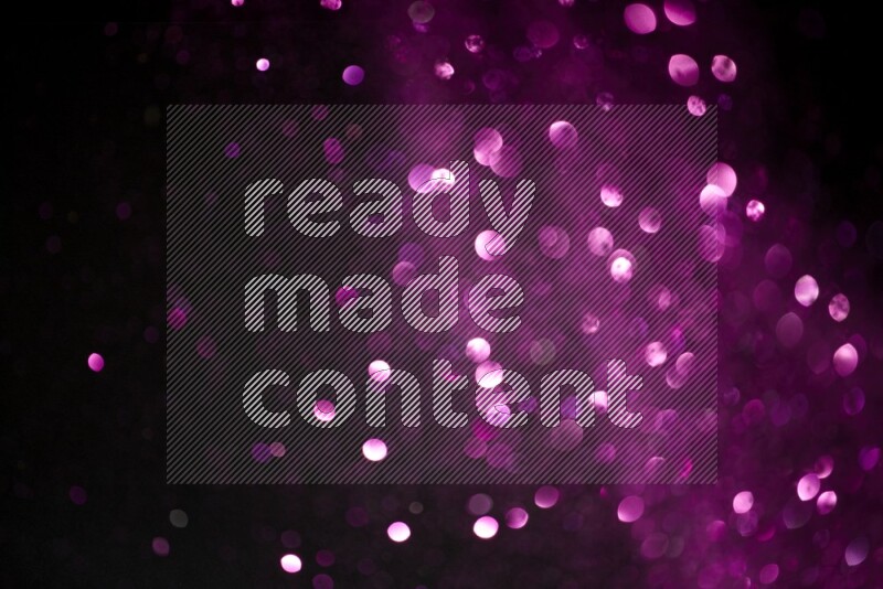 Pink glitter powder isolated on black background