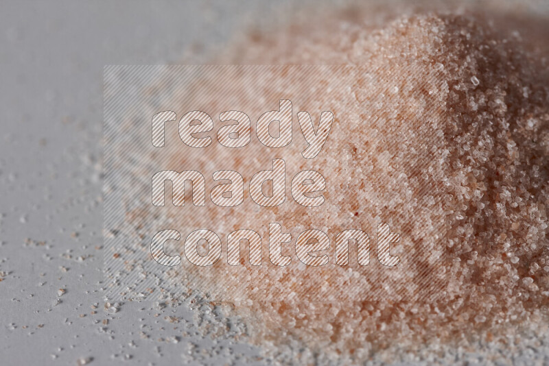 A bunch of fine himalayan salt on white background