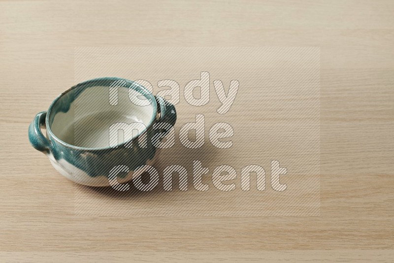 Multicolored Pottery Bowl on Oak Wooden Flooring, 45 degrees