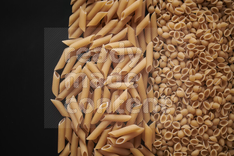 Different pasta types on black background