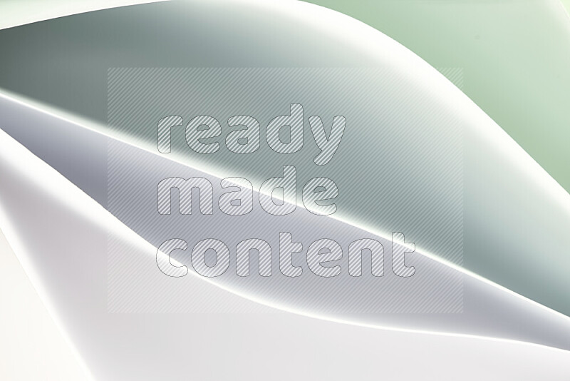 This image showcases an abstract paper art composition with paper curves in green and white gradients created by colored light