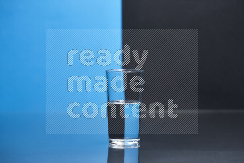 The image features a clear glassware filled with water, set against blue and black background