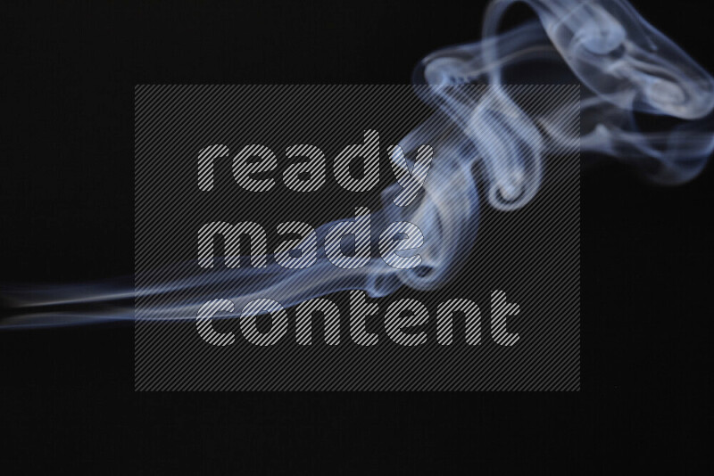Motion of wavy smoke isolated on dark background