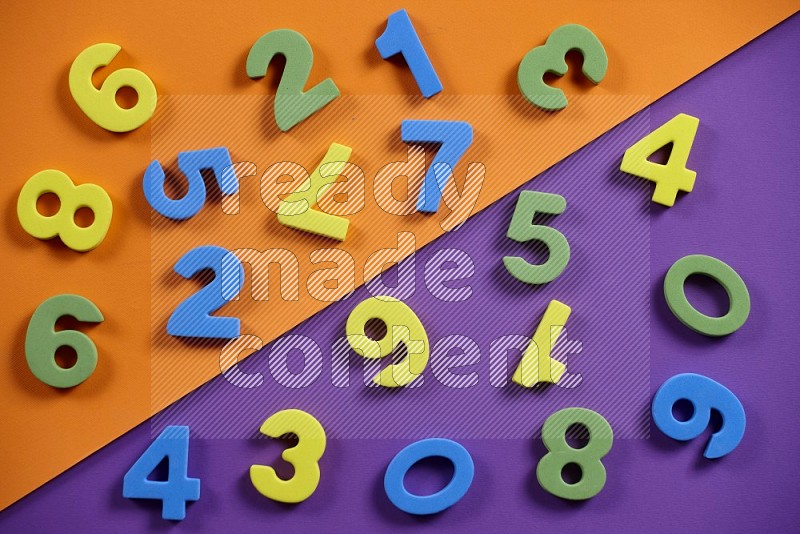 Foam numbers for kids on orange and purple background (kids toys)