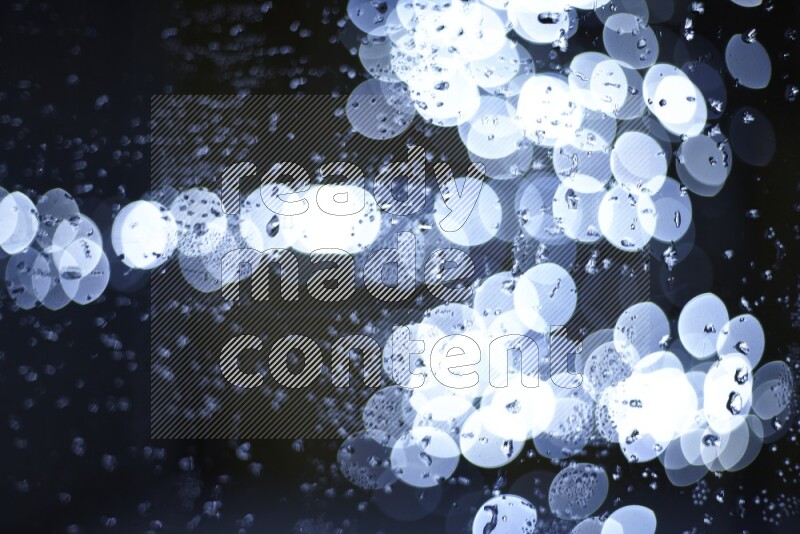 Bokeh light in white with water drops