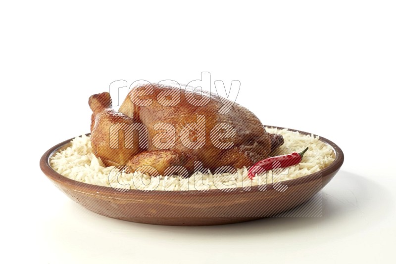 white  basmati Rice with  whole roasted chicken    on a pottery plate  direct  on white background