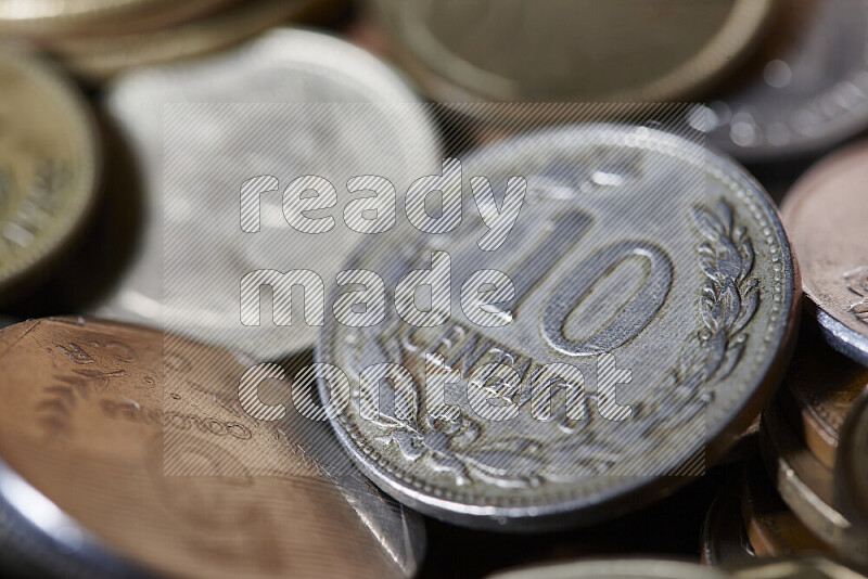 A close-ups of random old coins on black background